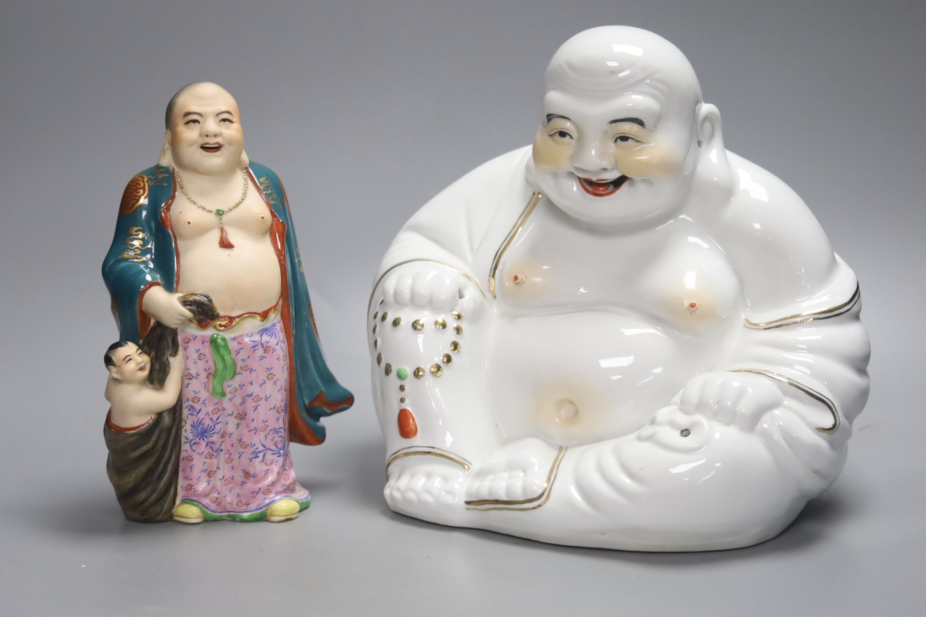Two Chinese porcelain figures of Budai, tallest 23cm